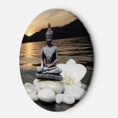 Rundes Leinwandbild Buddha vor dem Hintergrund der untergehenden Sonne 