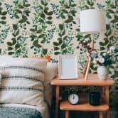 Non-woven wallpaper with a green leaf pattern on a white background 