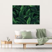 Leinwandbild, Exotische Blätter in monochromem Grün 