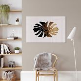 Glasbild Kubistika - Schwarz-goldene Monstera Blätter 