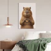 Leinwandbild Capybara mit Herzhand 