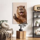 Leinwandbild Happy Capybara mit Daumen hoch 