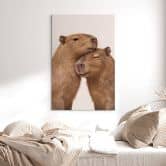 Leinwandbild Kuschelndes Capybara-Pärchen 