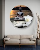 Rundes Leinwandbild Buddha vor dem Hintergrund der untergehenden Sonne 