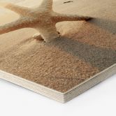 Hexagon Holzbild Funkelnder Seestern am einsamen Strand 